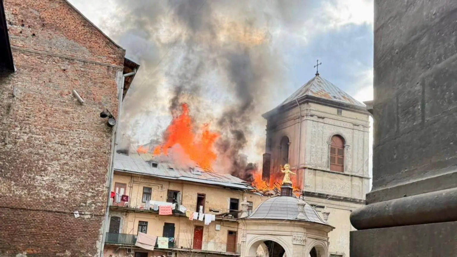 Lviv officials posted images of a residential building on fire next to the Bernardine monastery. (Andriy Sadovyi/Telegram)