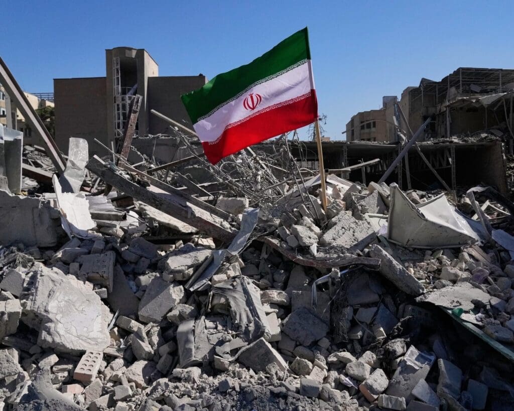 Iranian flag amidst rubble and destruction