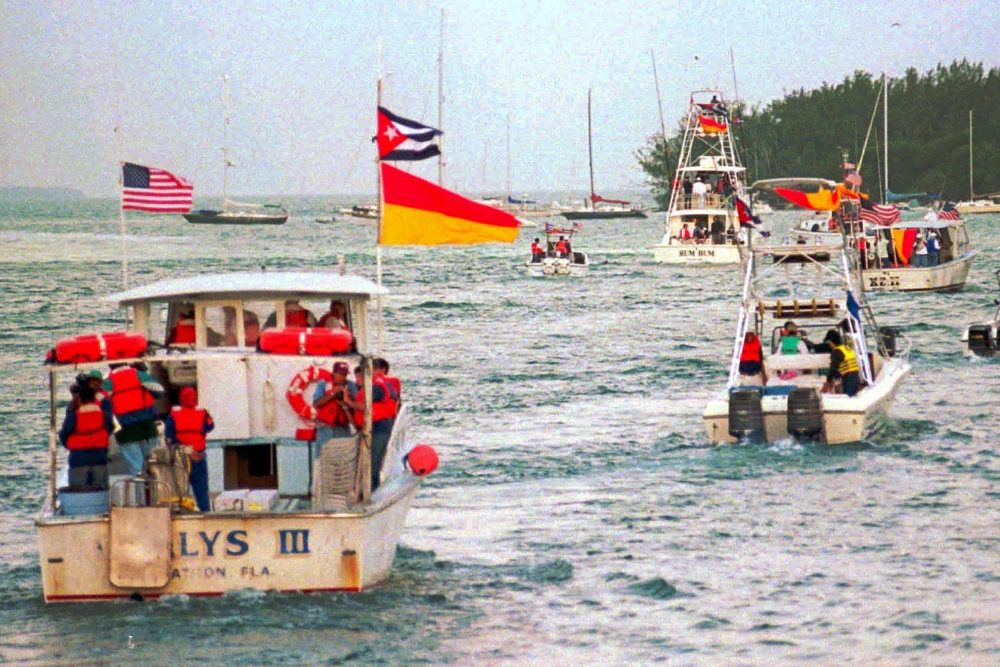 Boats from a flotilla head for open waters off Key West, Fla., on March 2, 1996, carrying Cuban Americans to the site of the downing of two Brothers to the Rescue planes by Cuban fighters.