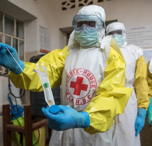 A technician performs an Ebola test.