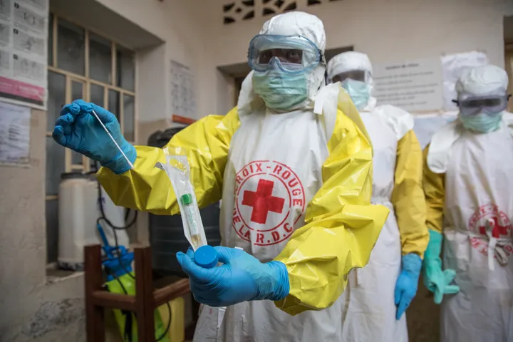 A technician performs an Ebola test.