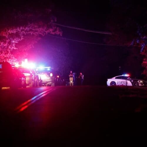 Police block off part of a street in Edmond, Oklahoma, after a campground shooting at Lake Arcadia on Sunday.
