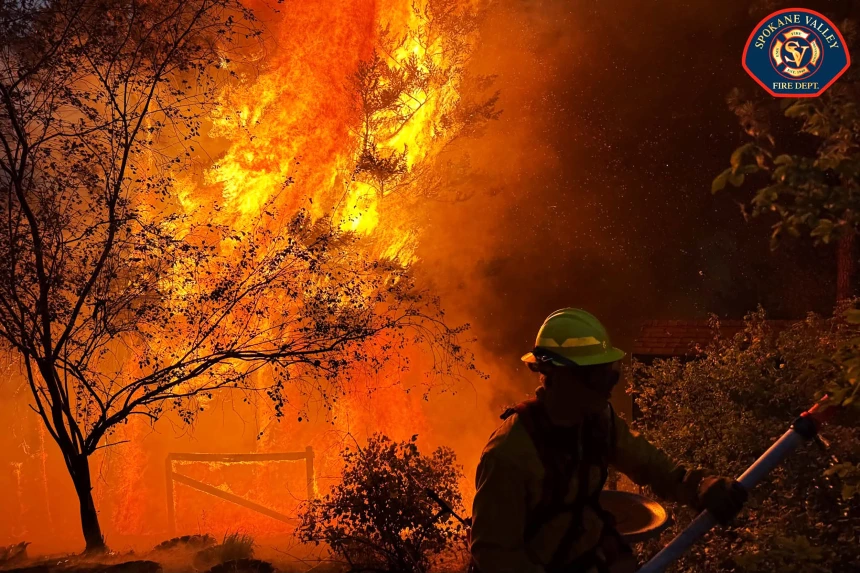 A wildland firefighter battling the Spokane, WA blazes